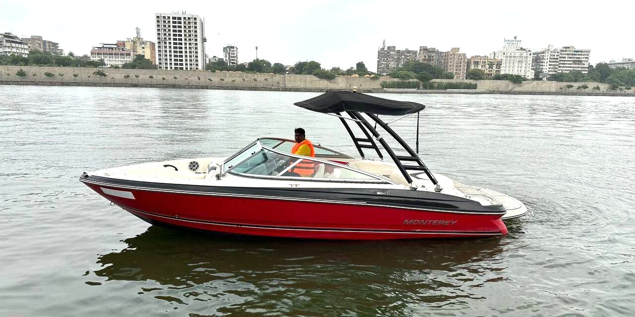 A men ride monterey speed boat on water